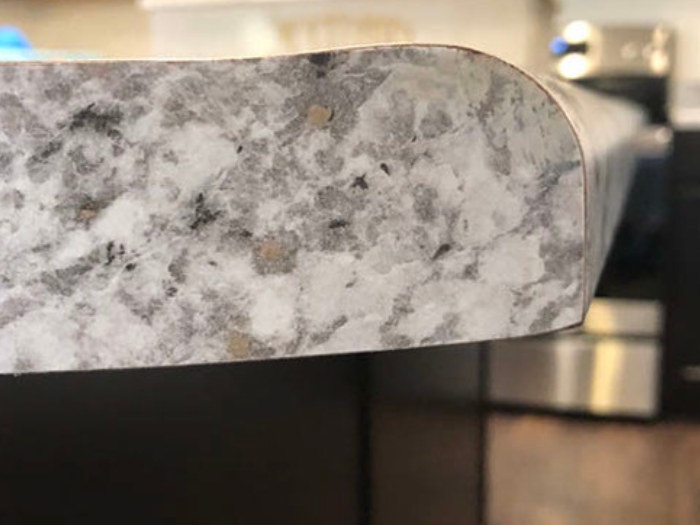 Finished basement remodel with entertainment area and warm lighting