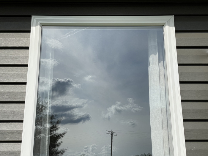 Finished basement remodel with entertainment area and warm lighting